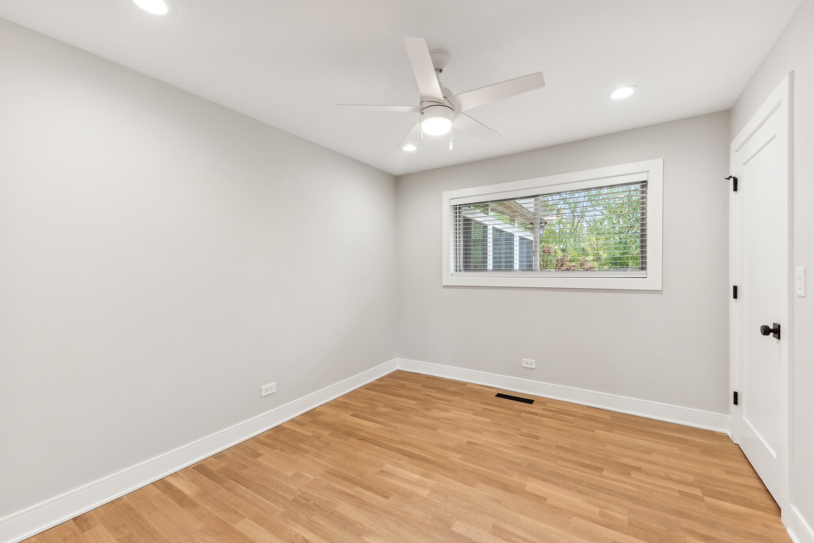 832 Sumac Road Highland Park, IL 60035 - Photo 17 of 20 wooden floor in an empty room with a window