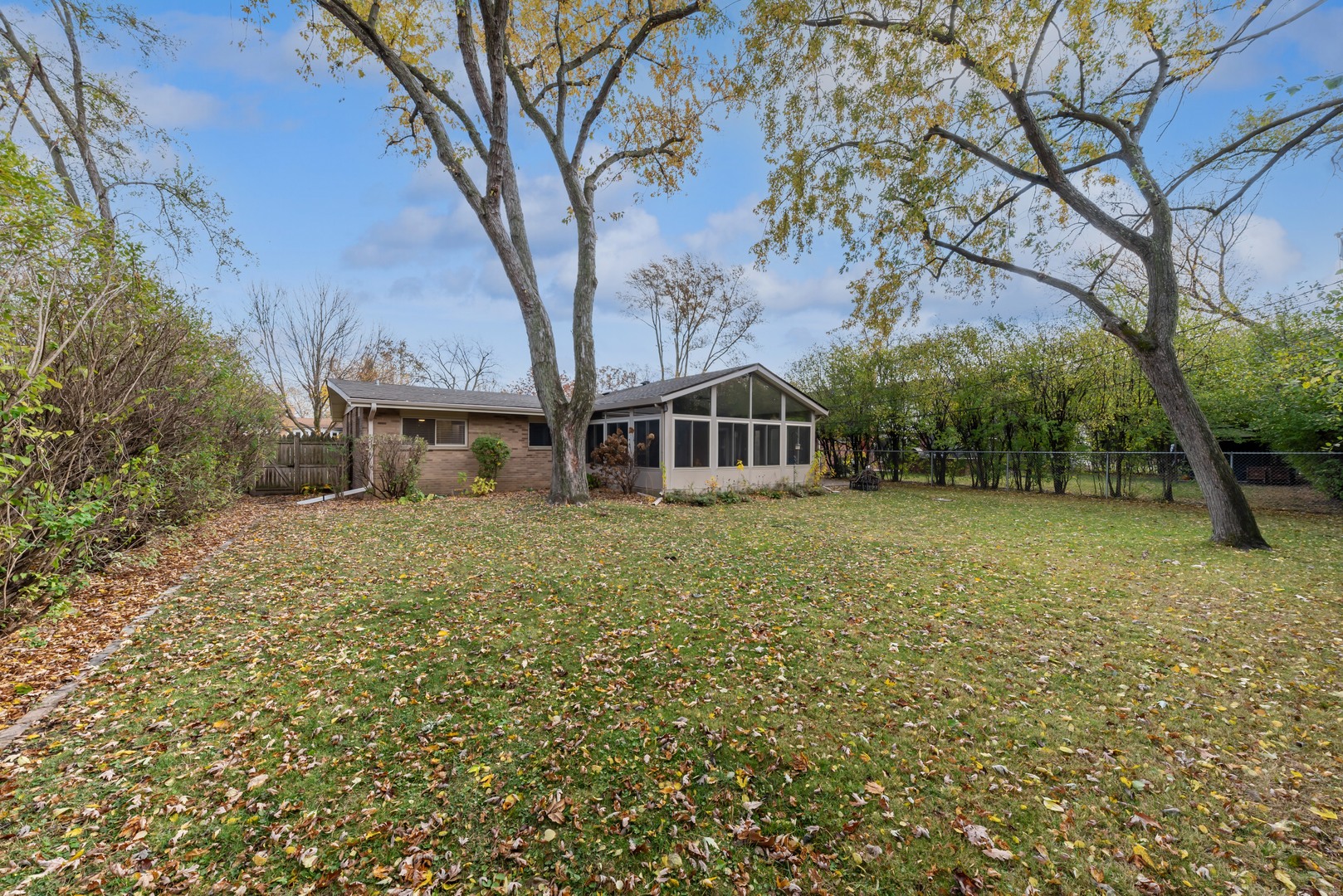 832 Sumac Road Highland Park, IL 60035 - Photo 19 of 20 a house with trees in front of it