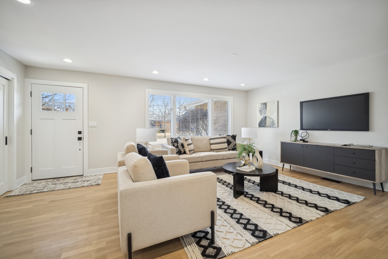 832 Sumac Road Highland Park, IL 60035 - Photo 3 of 20 a living room with furniture and a flat screen tv