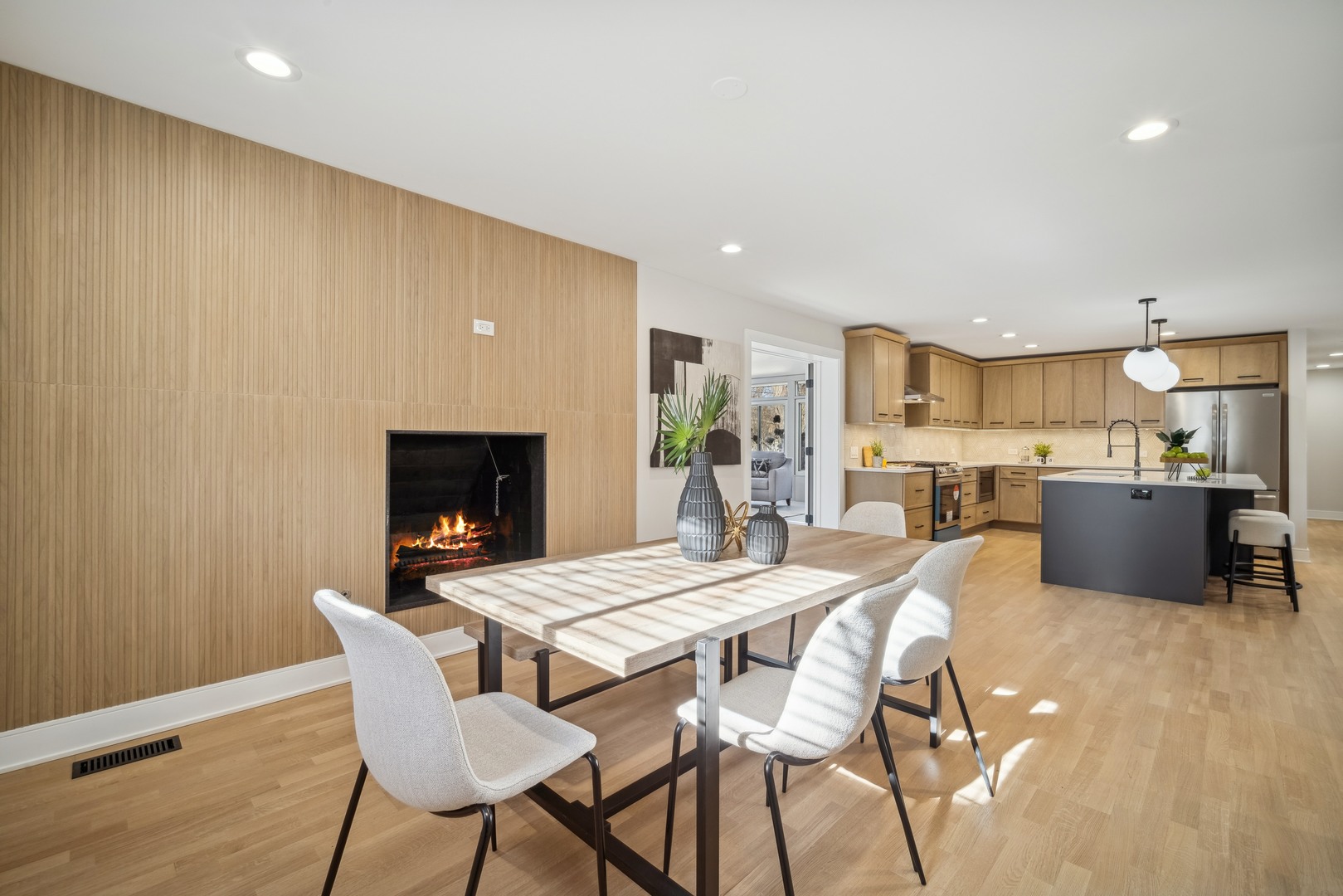 832 Sumac Road Highland Park, IL 60035 - Photo 10 of 20 a view of a dining room with furniture and a fireplace