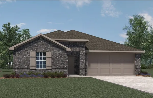 a front view of a house with a garden and yard