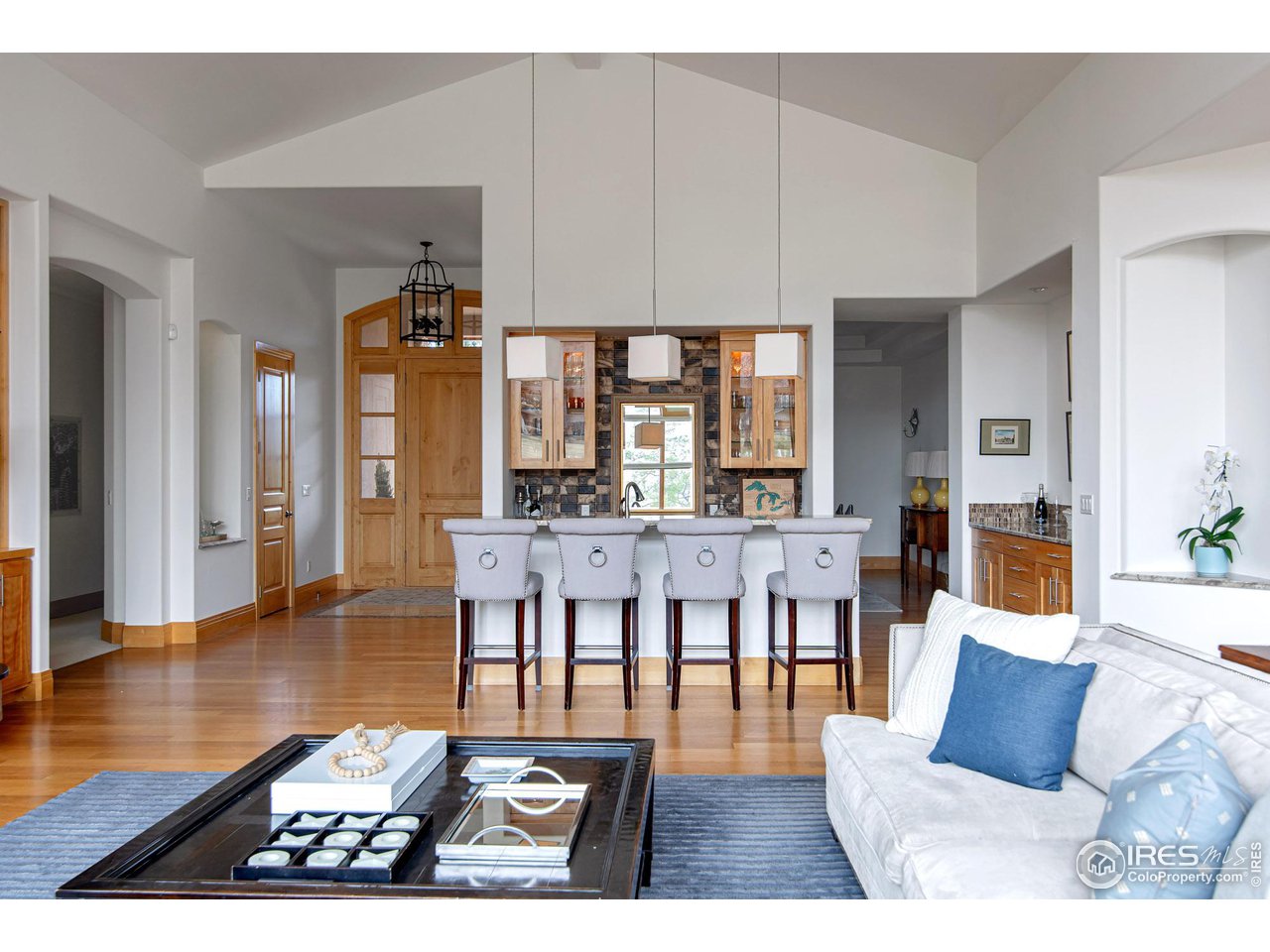 6922 Frying Pan Road Boulder, CO 80301 - Photo 12 of 39 a living room with furniture a rug and a dining table