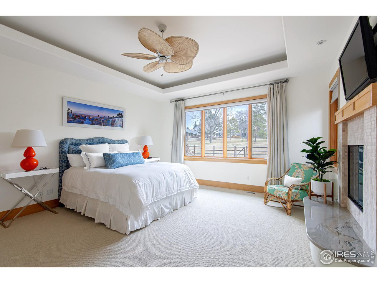 6922 Frying Pan Road Boulder, CO 80301 - Photo 13 of 39 a bed room with a bed and a chandelier