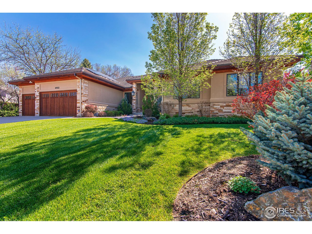 6922 Frying Pan Road Boulder, CO 80301 - Photo 2 of 39 a front view of a house with a yard