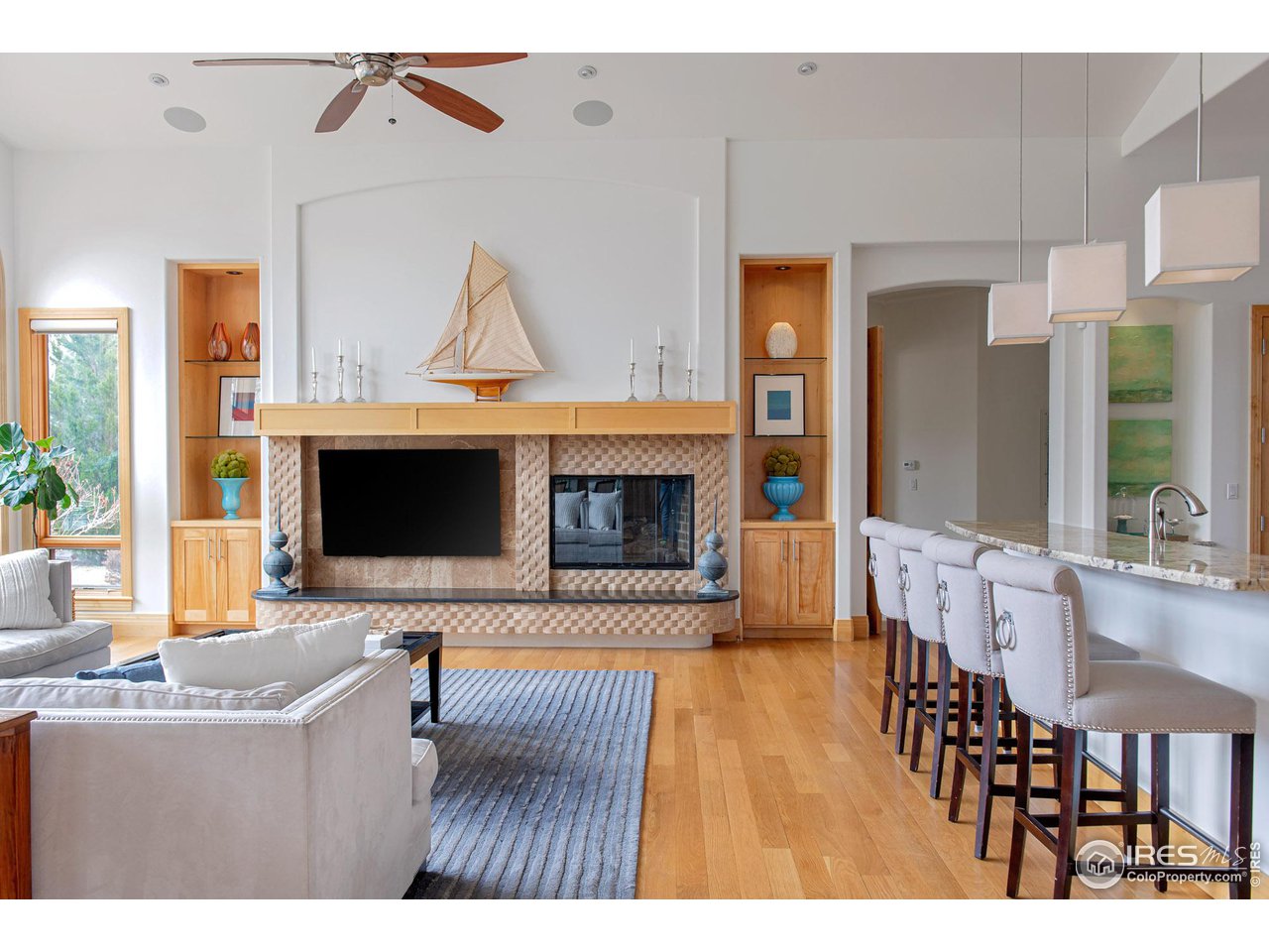 6922 Frying Pan Road Boulder, CO 80301 - Photo 25 of 39 a living room with furniture and a flat screen tv