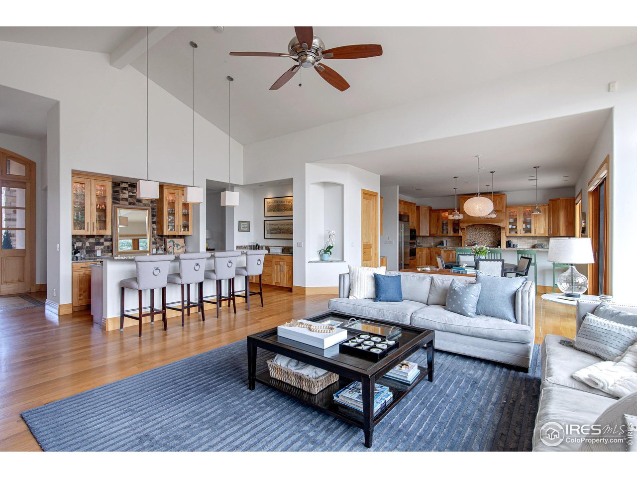 6922 Frying Pan Road Boulder, CO 80301 - Photo 28 of 39 a living room with furniture a rug and a chandelier