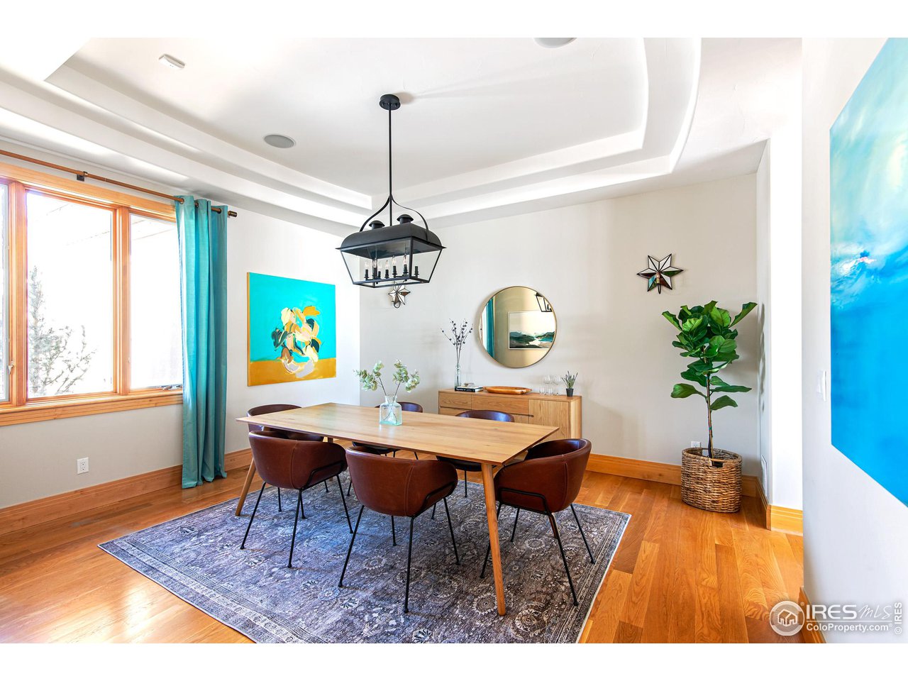 6922 Frying Pan Road Boulder, CO 80301 - Photo 29 of 39 a view of a dining room with furniture window and wooden floor
