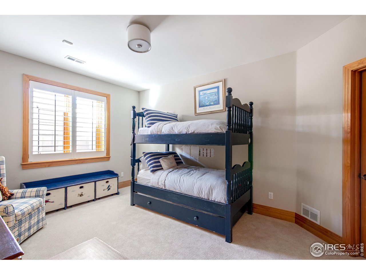 6922 Frying Pan Road Boulder, CO 80301 - Photo 31 of 39 a bedroom with a bed and a window