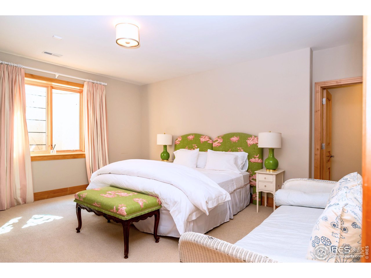 6922 Frying Pan Road Boulder, CO 80301 - Photo 37 of 39 a bedroom with a bed and a window