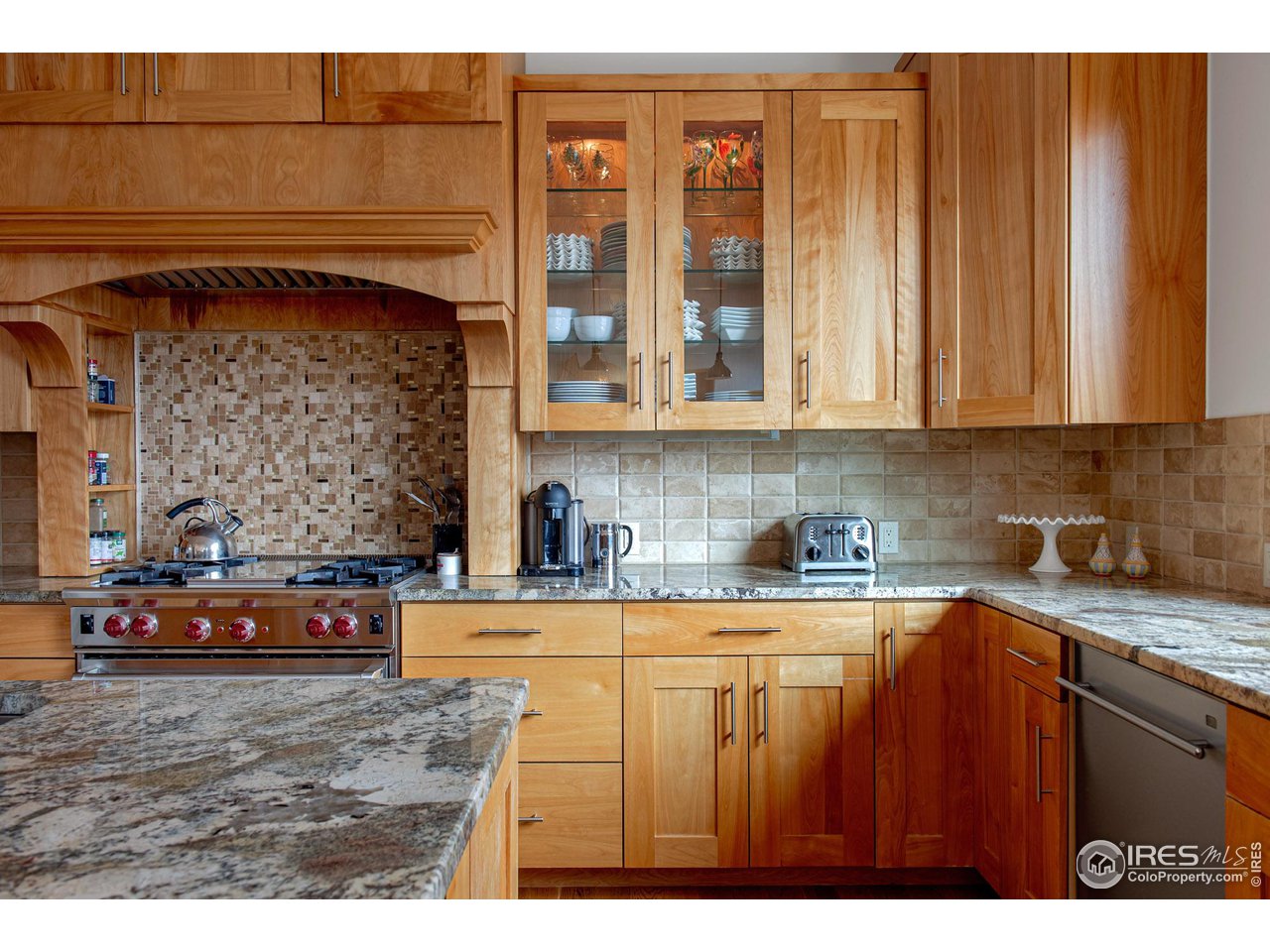 6922 Frying Pan Road Boulder, CO 80301 - Photo 4 of 39 a kitchen with stainless steel appliances granite countertop a stove and cabinets