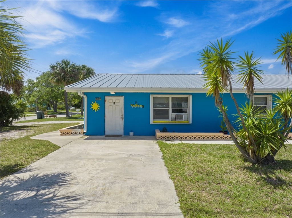221 Balboa Street, Unit A Fort Pierce, FL 34949 - Photo 1 of 36 a front view of a house with a yard
