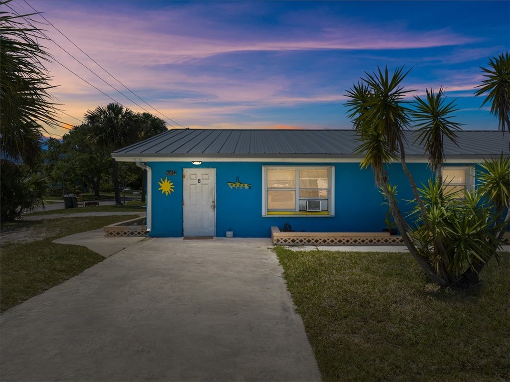 221 Balboa Street, Unit A Fort Pierce, FL 34949 - Photo 2 of 36 a front view of a house with a yard