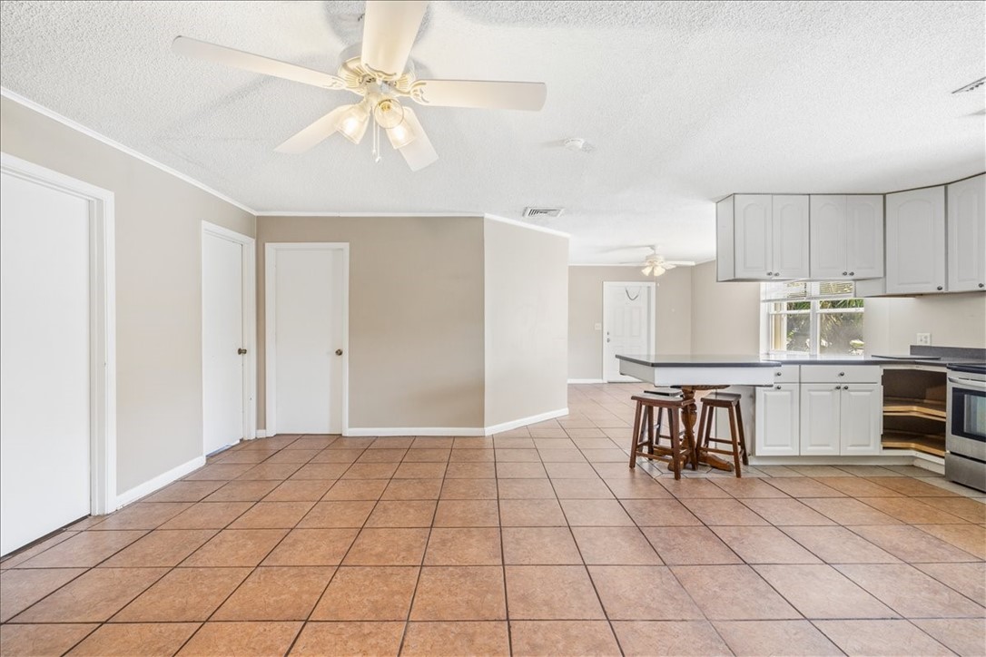 221 Balboa Street, Unit A Fort Pierce, FL 34949 - Photo 3 of 36 a view of kitchen with granite countertop cabinets and window