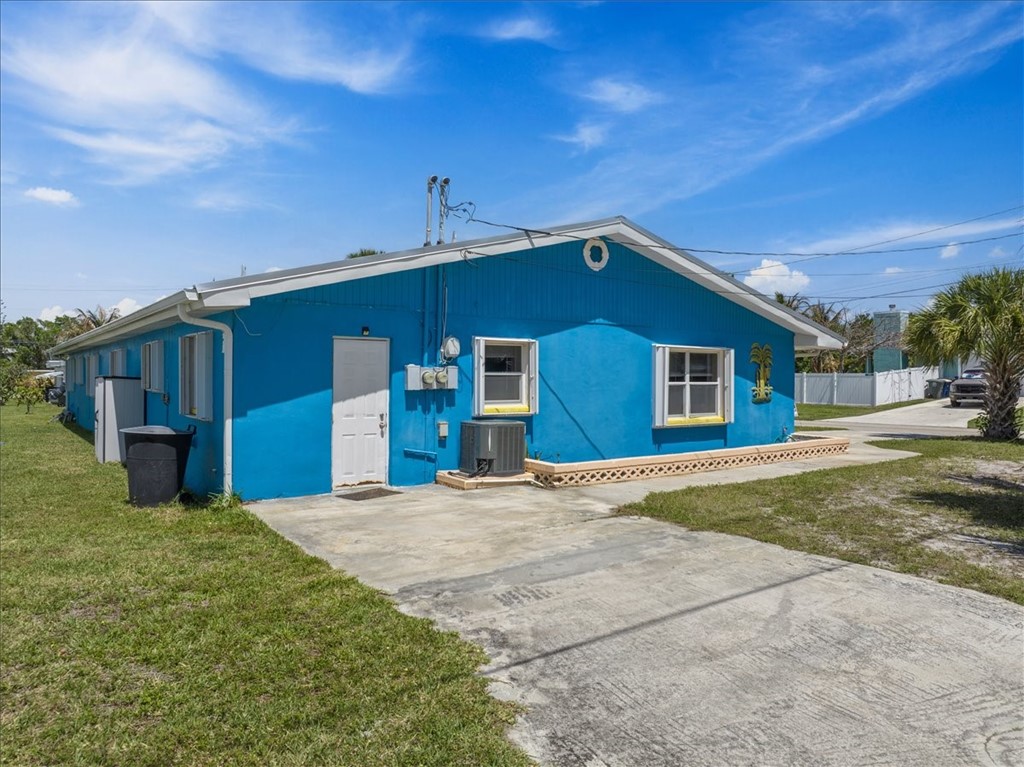 221 Balboa Street, Unit A Fort Pierce, FL 34949 - Photo 31 of 36 a front view of a house with a yard