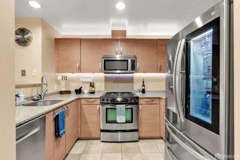 a kitchen with a stove and a refrigerator