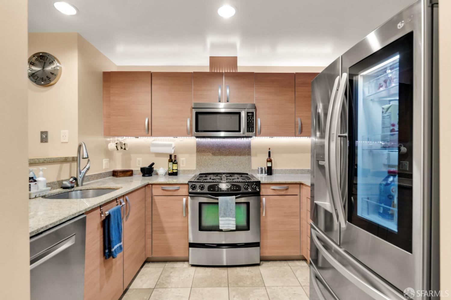 1 Mandalay Place, Unit 908 South San Francisco, CA 94080 - Photo 14 of 40 a kitchen with a stove and a refrigerator