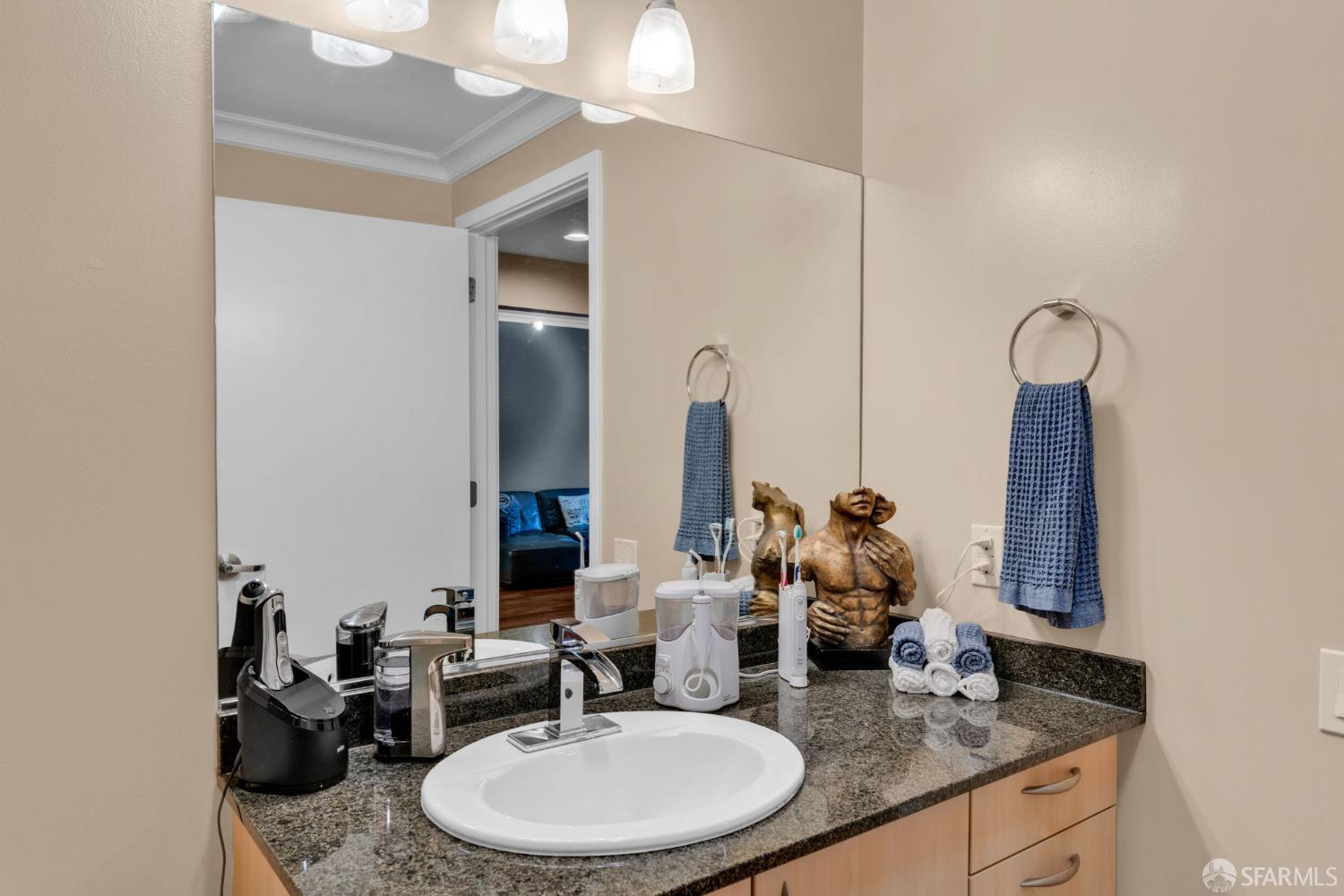 1 Mandalay Place, Unit 908 South San Francisco, CA 94080 - Photo 18 of 40 a bathroom with double vanity sinks and a mirror