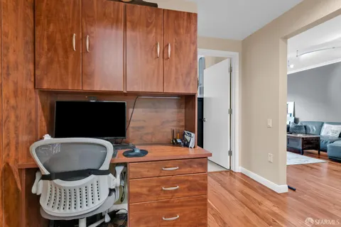 a dining room with furniture and wooden floor