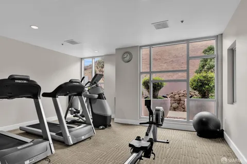a view of a livingroom with furniture and windows