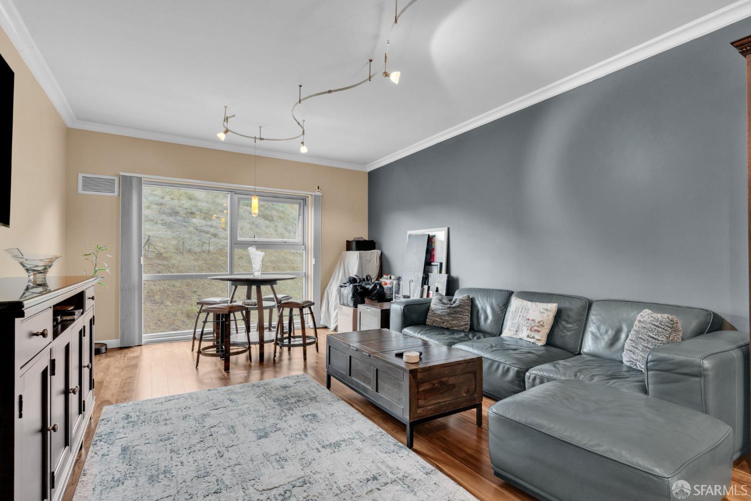 1 Mandalay Place, Unit 908 South San Francisco, CA 94080 - Photo 3 of 40 a living room with furniture and a flat screen tv
