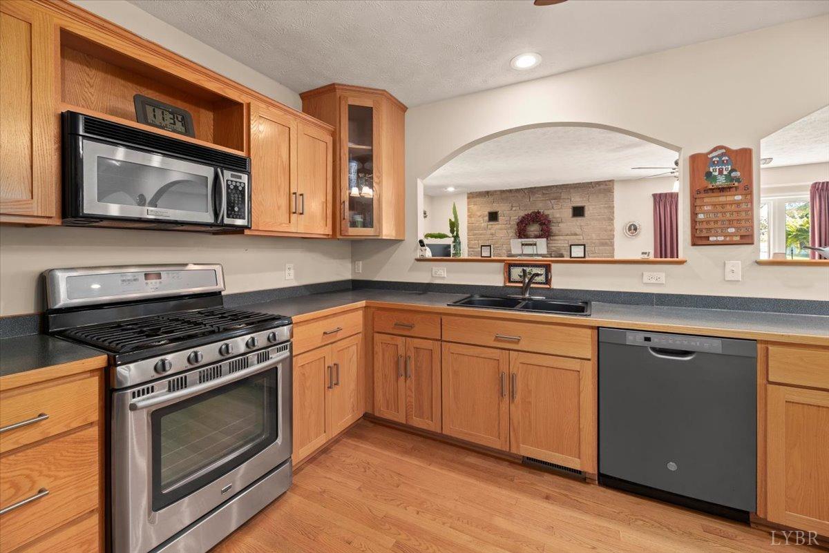 159 Blue Ridge Lane Amherst, VA 24521 - Photo 12 of 71 a kitchen with stainless steel appliances a stove microwave and sink
