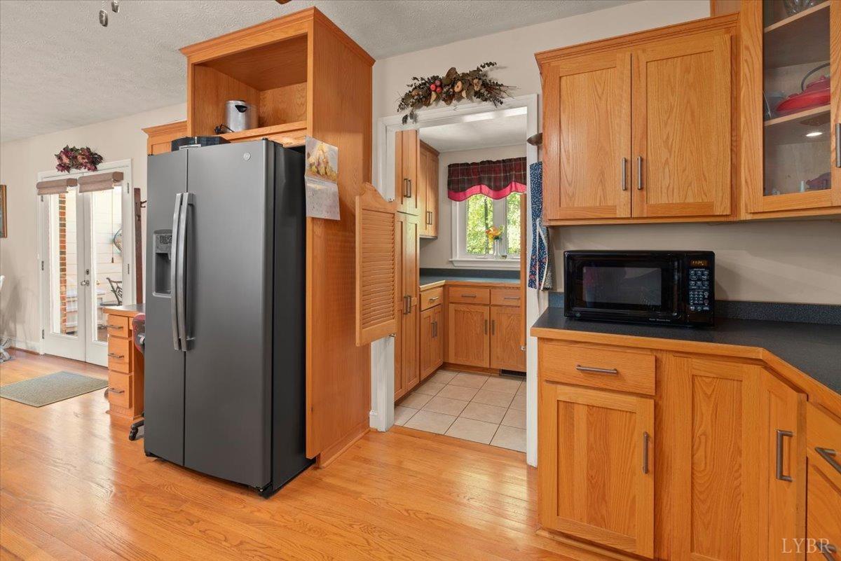 159 Blue Ridge Lane Amherst, VA 24521 - Photo 13 of 71 a kitchen with stainless steel appliances granite countertop a refrigerator a sink and dishwasher with wooden floor