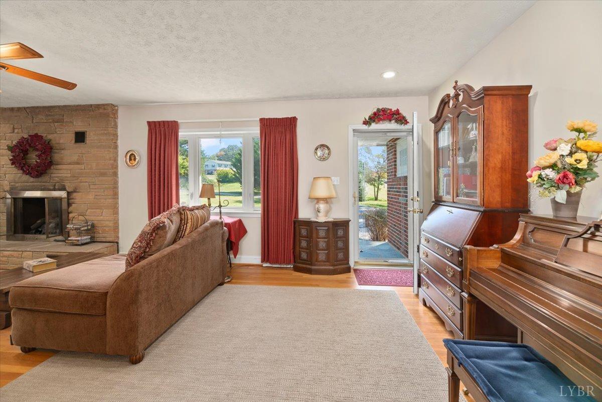 159 Blue Ridge Lane Amherst, VA 24521 - Photo 3 of 71 a living room with furniture a flat screen tv and a fireplace
