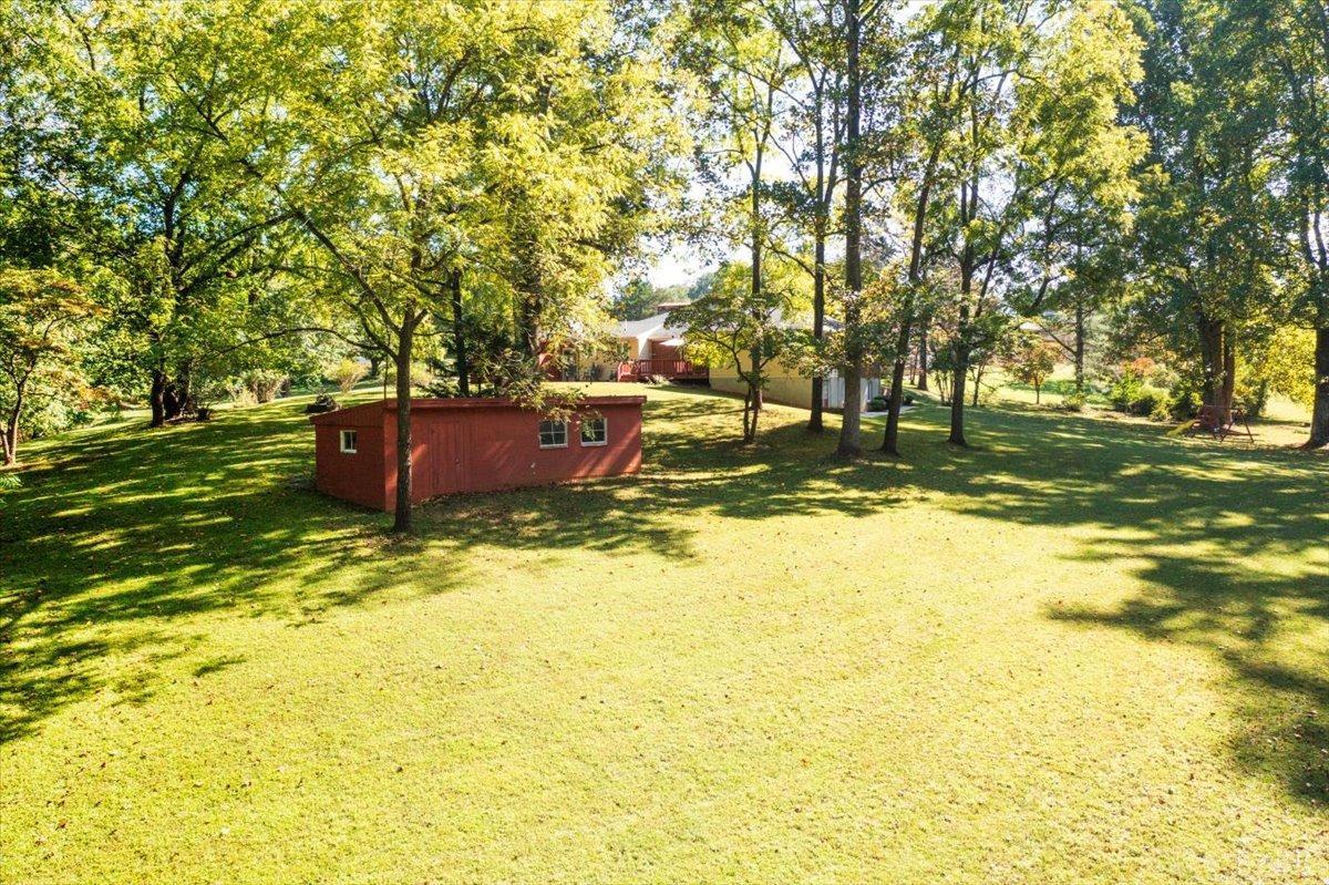 159 Blue Ridge Lane Amherst, VA 24521 - Photo 68 of 71 a backyard of a house with a yard and large trees
