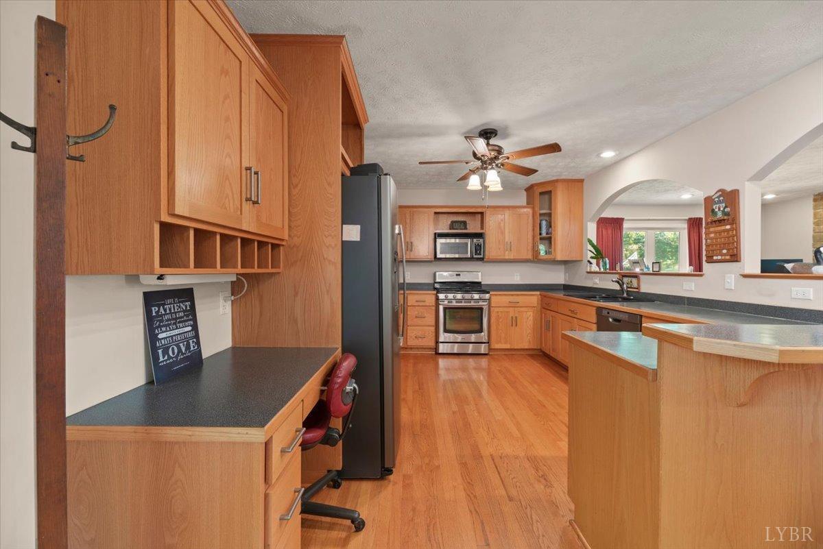 159 Blue Ridge Lane Amherst, VA 24521 - Photo 7 of 71 a kitchen with stainless steel appliances granite countertop a sink stove and refrigerator