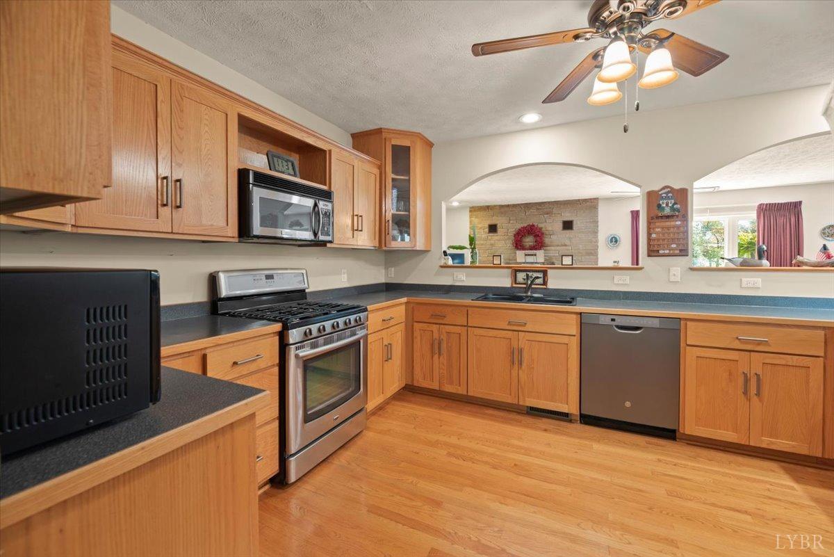159 Blue Ridge Lane Amherst, VA 24521 - Photo 10 of 71 a kitchen with stainless steel appliances granite countertop a sink dishwasher a stove and a microwave oven with cabinets