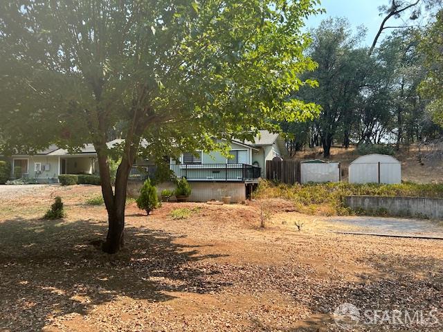 19481 Rambling Oak Drive Redding, CA 96003 - Photo 15 of 62 a front view of a house with a yard