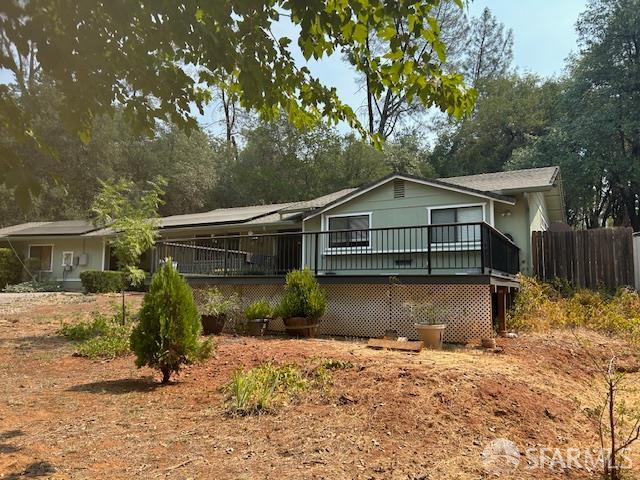 19481 Rambling Oak Drive Redding, CA 96003 - Photo 16 of 62 a front view of a house with a yard