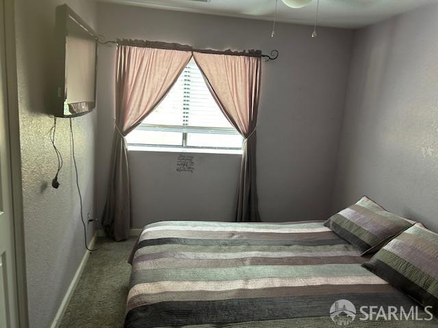 19481 Rambling Oak Drive Redding, CA 96003 - Photo 35 of 62 a bedroom with a bed and a window