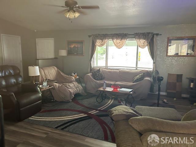 19481 Rambling Oak Drive Redding, CA 96003 - Photo 40 of 62 a living room with furniture and a large window