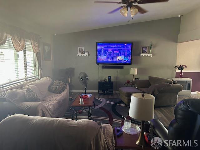 19481 Rambling Oak Drive Redding, CA 96003 - Photo 42 of 62 a living room with furniture and a flat screen tv