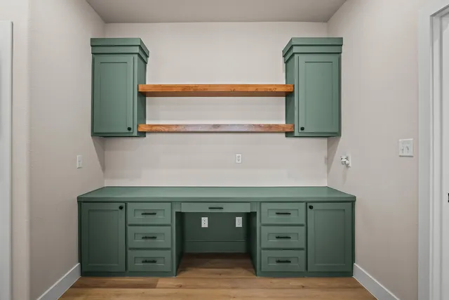 a view of cabinets and a dresser