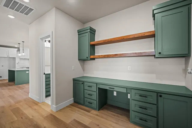 a kitchen with a cabinets and a stove