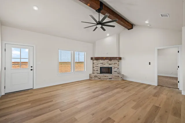 a view of a kitchen with furniture and a fireplace
