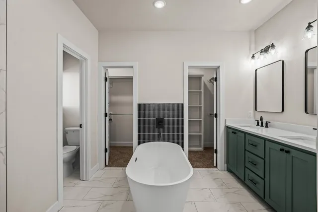 a bathroom with a tub and shower