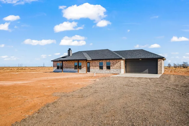 a front view of a house with yard