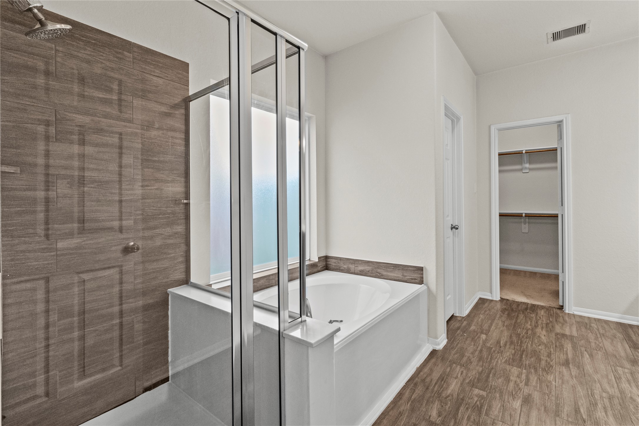 14610 Ruddy Duck Lane Houston, TX 77049 - Photo 15 of 24 a bathroom with a tub and shower