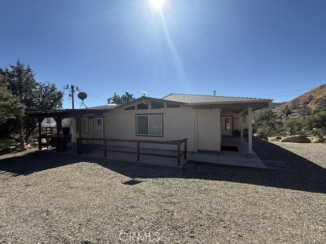 9780 Fay Ranch Road Weldon, CA 93283 - Photo 16 of 47 a front view of a house with a yard