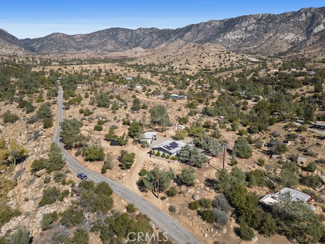 9780 Fay Ranch Road Weldon, CA 93283 - Photo 22 of 47 a view of a mountain range with lush green forest