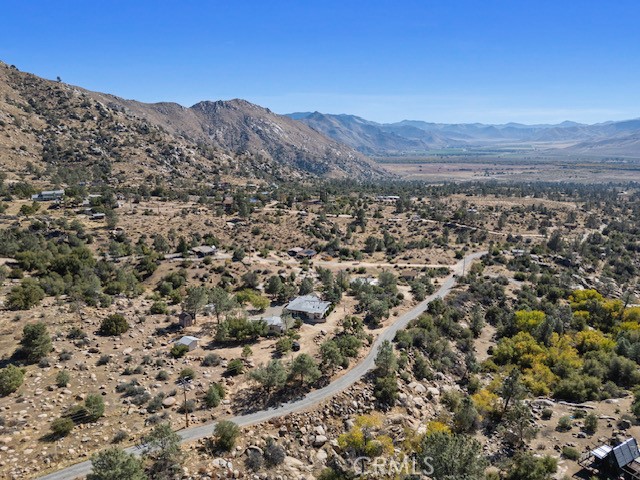 9780 Fay Ranch Road Weldon, CA 93283 - Photo 25 of 47 a view of a mountain range in a cloudy sky