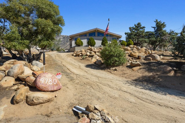 9780 Fay Ranch Road Weldon, CA 93283 - Photo 36 of 47 a front view of a house with a yard