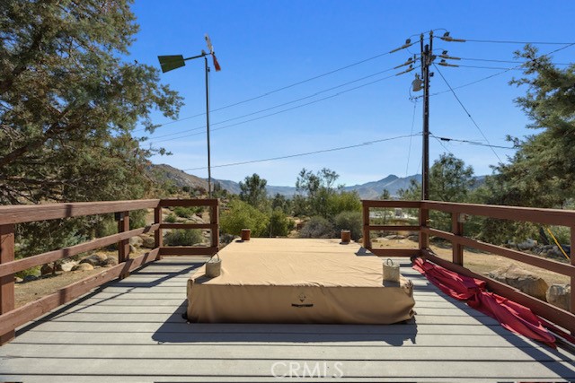 9780 Fay Ranch Road Weldon, CA 93283 - Photo 41 of 47 a roof deck with wooden floor and fence