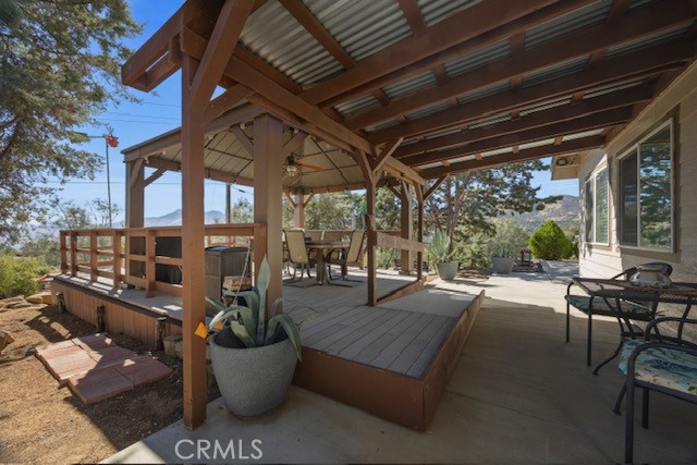 9780 Fay Ranch Road Weldon, CA 93283 - Photo 42 of 47 a view of a patio with table and chairs and potted plants