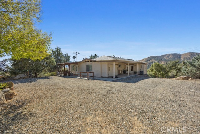 9780 Fay Ranch Road Weldon, CA 93283 - Photo 44 of 47 a tall tree in front of a house