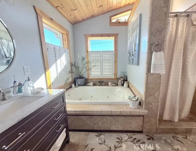 a bathroom with a bathtub and a sink
