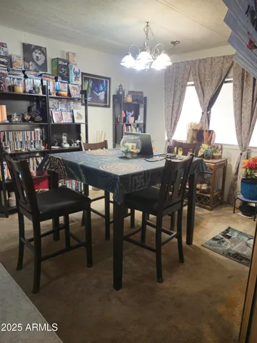 a view of a dining room with furniture and window